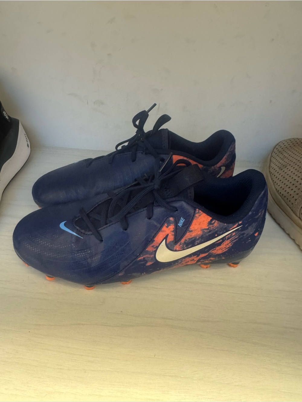 Nike Kids Navy and Orange Soccer Cleats with White Swoosh